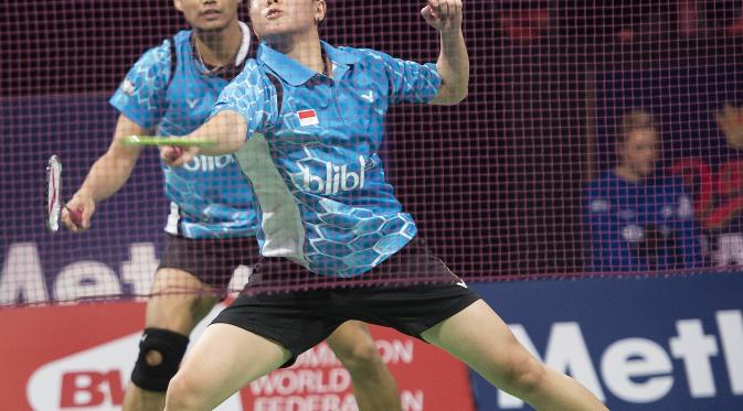 Ganda campuran Indonesia Tontowi Ahmad/Liliyana Natsir gagal menjuarai Denmark Open Super Series Premier 2015, Minggu (18/10/2015). (Liputan6.com/CLAUS FISKER / SCANPIX DENMARK / AFP)