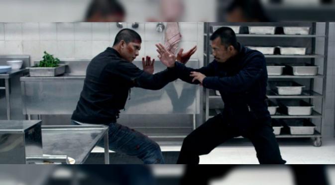 Iko Uwais dan Cecep Arif Rahman dalam film The Raid 2 (Slash Film)