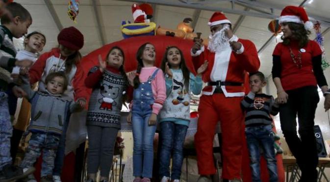 Warga Irak Rayakan Maulid Nabi dan Natal di Tengah Kepungan ISIS (Reuters)