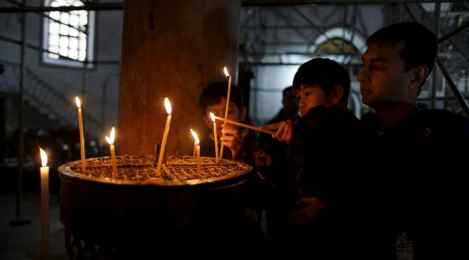 Misa Natal di Betlehem yang dibayangi ketakutan atas aksi kekerasan. (Reuters)