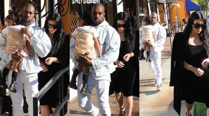 Kim Kardashian, North West, dan Kanye West (via aceshowbiz.com)