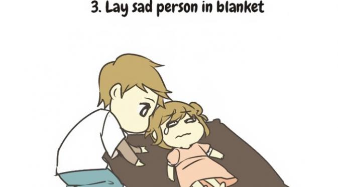 3. Baringkan temanmu yang lagi sedih di atas selimut. (Via: boredpanda.com)