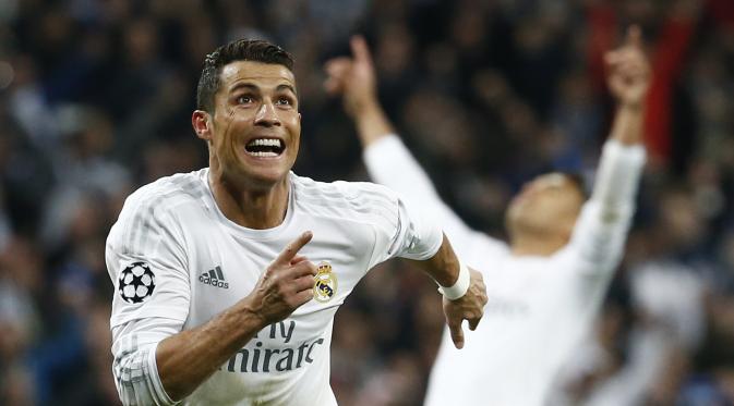 Ronaldo lari kegirangan usai cetak hattrick ke gawang Wolfsburg (Juan Medina/Reuters)