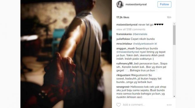 Maia Estianty menggenggam tangan seorang pria misterius [foto: instagram]