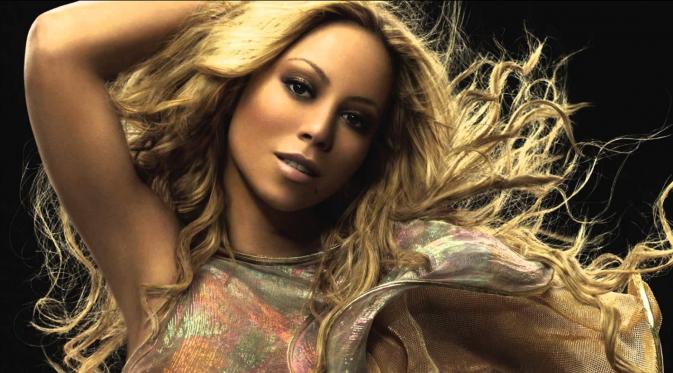 Mariah Carey tampil beda dan tak biasa dalam sebuah acara, menunjukkan bokongnya.