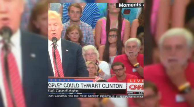 Seorang pria pojok kanan menyadari apa maksud Donald Trump. Ia terlihat kaget (screen cap CNN/Huffington Post)