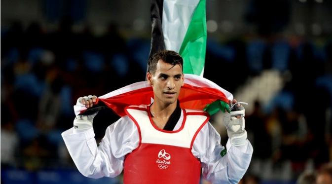 Ahmad Abughaush berhasil membuat Yordania bangga dengan sumbangan medali emasnya di Olimpiade Rio de Janeiro 2016. (AP Photo/Andrew Medichini)