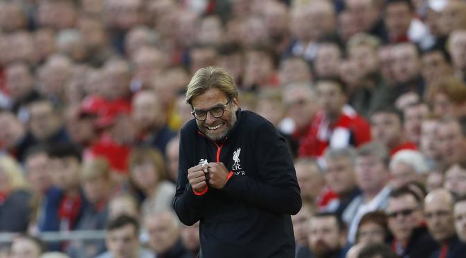 Ekspresi bahagia Jurgen Klopp menyaksikan kemenangan 4-1 Liverpool atas Leicester City di Anfield, Minggu (11/9/2016) dinihari WIB. (Reuters)