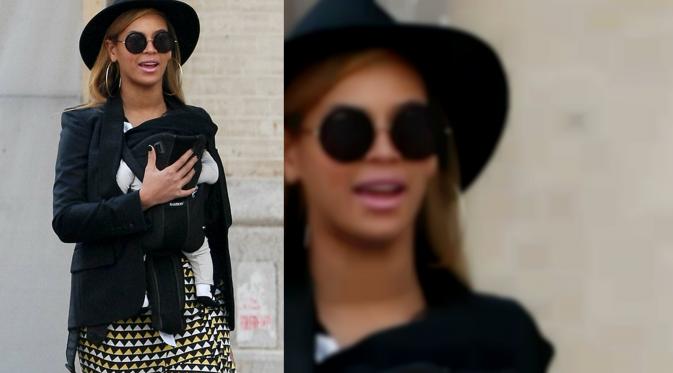 Beyonce tengah menyusui anaknya di jalan. (whattoexpect)