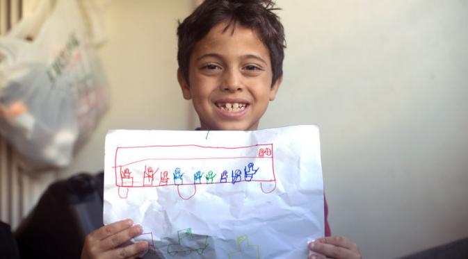 Aoumar Mazan Shabe (9) dari Suriah ingin menjadi sopir. (Via: boredpanda.com)