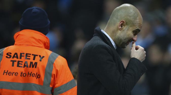 Ekspresi kekecewaan Pep Guardiola usai Manchester City ditahan Tottenham Hotspur 2-2. (AP Photo/Dave Thompson)
