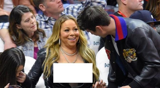 Mariah Carey kembali memamerkan payudaranya di depan publik. [foto: mirror.co.uk]