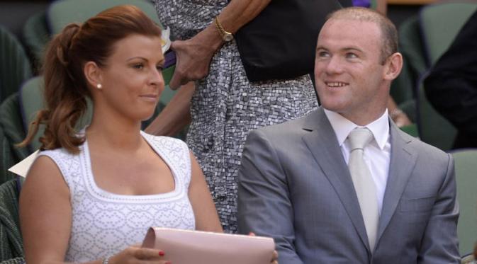 Wayne Rooney dan istrinya Coleen Rooney (AFP/Adrian Dennis)