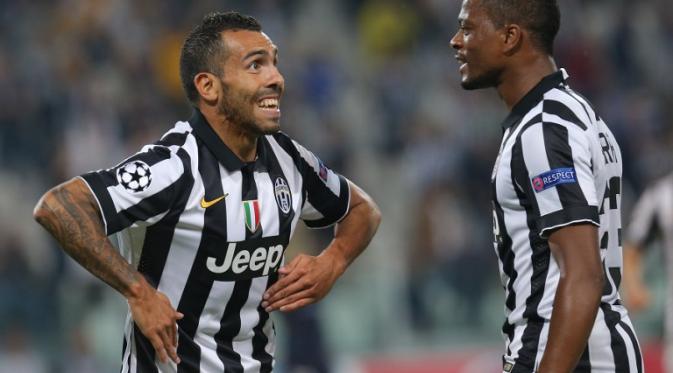 Patrice Evra dan Carlos Tevez dalam laga Juventus kontra Malmo (Marco Bertorello/AFP)