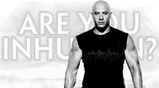Vin Diesel memajang foto saat dirinya tengah berdiri di depan kalimat bertuliskan "Are You Inhuman?".