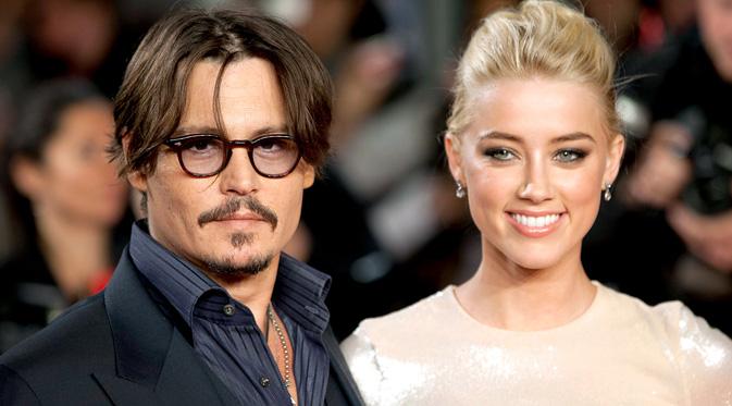 Johnny Depp dan Amber Heard. (foto: usmagazine)