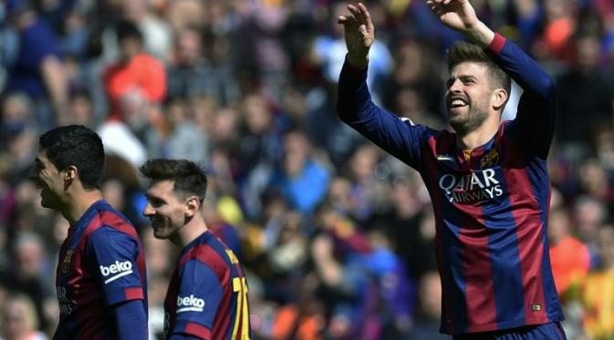 Gerrard Pique selebrasi usai cetak gol (LLUIS GENE / AFP)