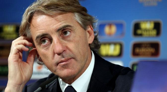 Inter Milan's Italian coach Roberto Mancini addresses a press conference after the UEFA Europa League first-leg, Round of 16 football match VfL Wolfsburg vs FC Internazionale Milano in Wolfsburg, northern Germany on March 12, 2015. Wolfsburg won the match