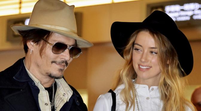 Johnny Depp dan Amber Heard. (foto: entertainmentwise)
