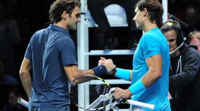 Roger Federer dan Rafael Nadal (CARL COURT / AFP)