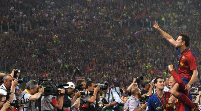 Xavi Hernandez saat perayaan juara usai juara Liga Champions 2009 lalu (CARL DE SOUZA / AFP)