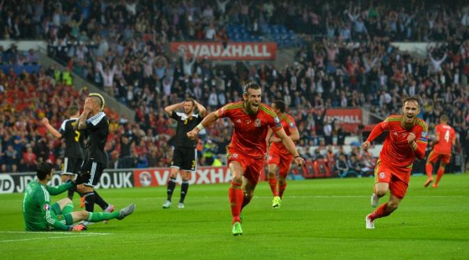CIAMIK - Winger timnas Wales, Gareth Bale tampil ciamik saat menghadapi Belgia di laga lanjutan Grup B kualifikasi Piala Eropa 2016. Bale sukses mencetak satu gol sekaligus membawa Wales menang 1-0. (GLYN KIRK/AFP)