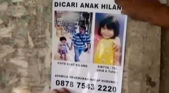 Keluarga besar Cintya menempelkan foto bocah 6 tahun yang diculik itu dan foto close up sang penculik.