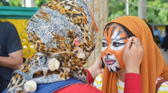 Aksi kampanye memperingati Global Tiger Day di Lapangan Merdeka, Medan, Sumatera Utara, Minggu (9/8/2015). (Liputan6.com/Reza Perdana)
