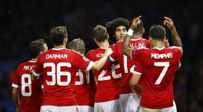 Pemain MU merayakan gol yang dicetak Marouane Fellaini saat melawan Club Brugge, pekan lalu.