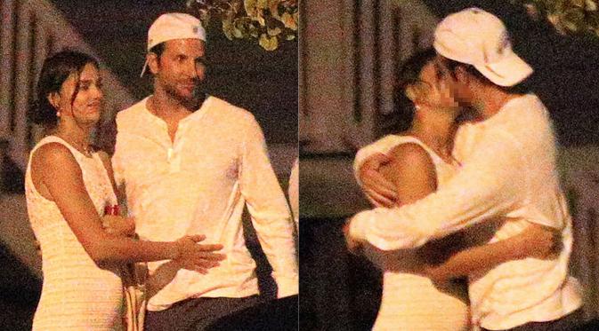 Bradley Cooper lagi-lagi mencium Irina Shayk di depan umum setelah makan malam bersama ibundanya. (foto: eonline)
