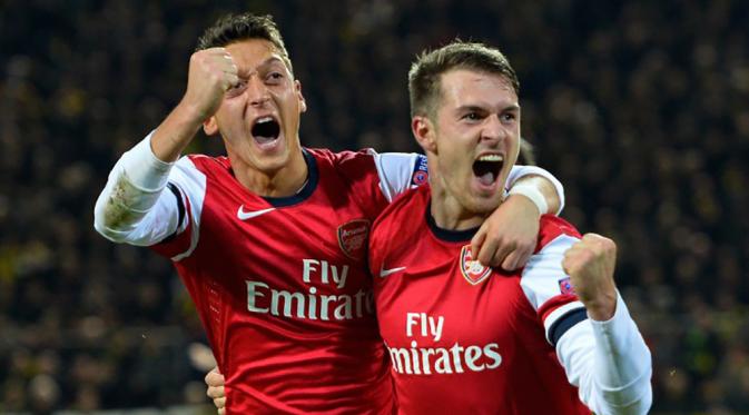 Penjualan jersey dari Arsenal berada pada posisi ketujuh dengan angka 800.000 juta per tahun. Jersey bernama Mesut Ozil menjadi salah satu yang terlaris. (AFP Photo/Odd Andersen)