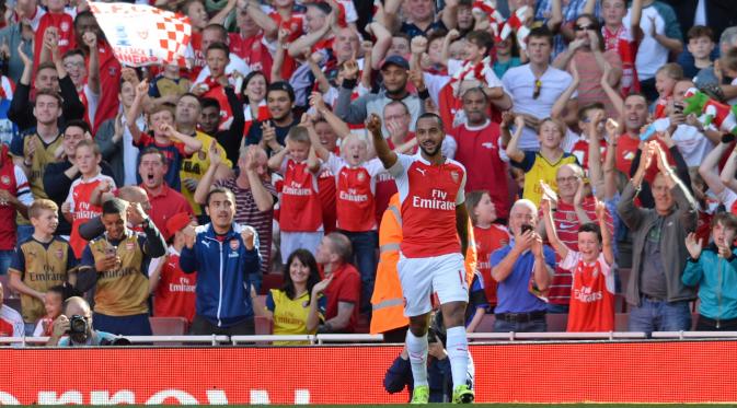 Theo Walcott celebrates after scoring the first goal for Arsenal Action Images via Reuters / Alan Walter